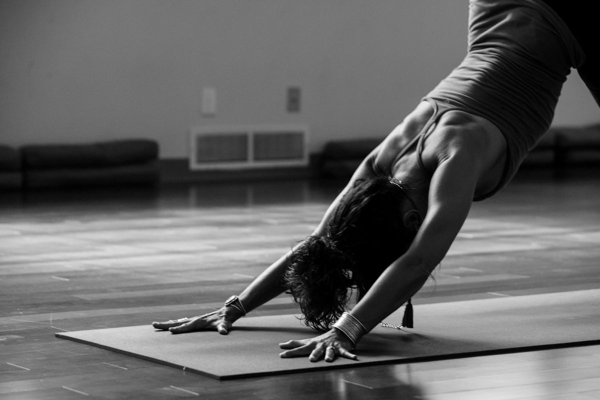 Working out on a mat in a bright living room